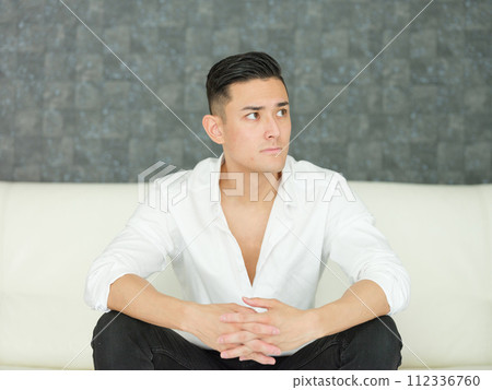 Men sitting on the sofa Men sitting on the sofa 112336760