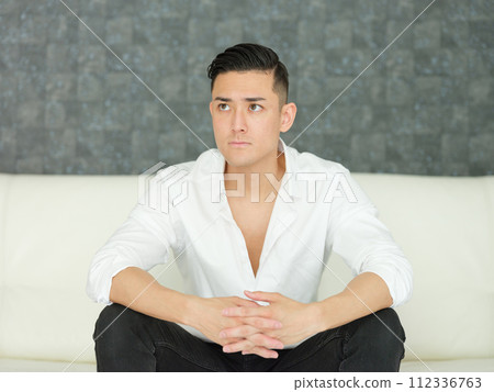 Men sitting on the sofa 112336763