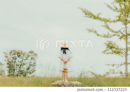 A girl with a sunflower A girl with a sunflower 112337225