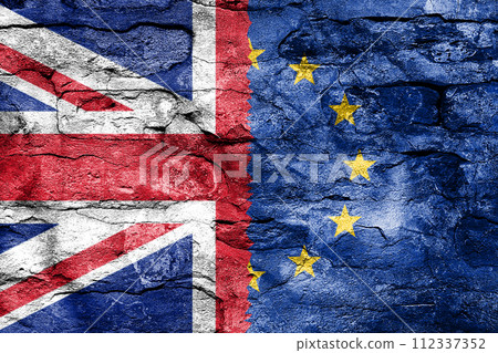 Brexit Concept. Half of European Union EU flag and Great Britain flag on an Old Brick Wall 112337352