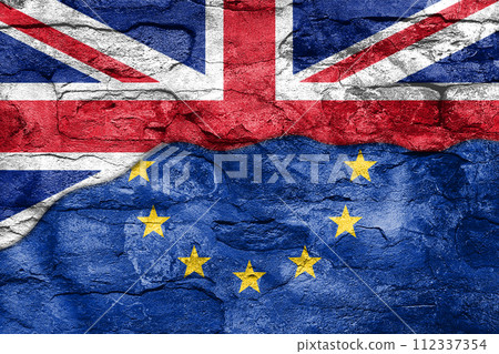 Brexit Concept. Half of European Union EU flag and Great Britain flag on an Old Brick Wall 112337354