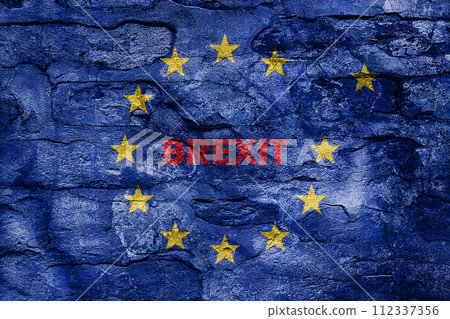 European Union Blue Flag With Yellow Stars On Old Brick Wall and Brexit Text European Union Blue Flag With Yellow Stars On Old Brick Wall and Brexit Text 112337356