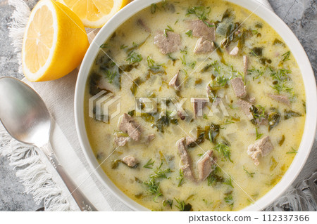 Magiritsa is a Greek soup made from lamb offal, associated with the Easter tradition close-up in a bowl. Horizontal top view 112337366