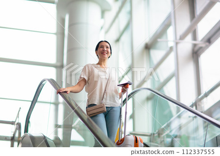 Young Asian woman in airport. Travel by air. 112337555