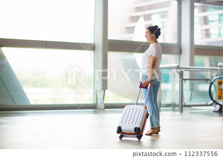 Young Asian woman in airport. Travel by air. Young Asian woman in airport. Travel by air. 112337556