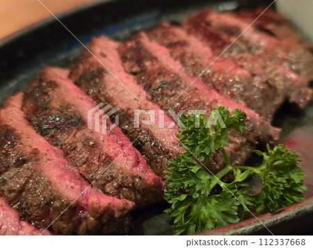 Close up Beef Steak Medium Rare. Grilled Juicy steak medium rare beef with herbs. Close up Beef Steak Medium Rare. Grilled Juicy steak medium rare beef with herbs. 112337668
