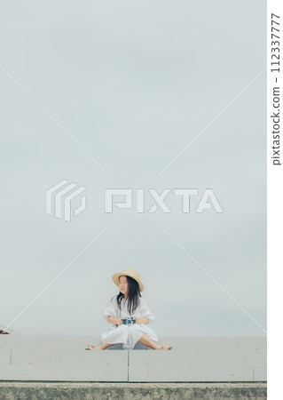 girl holding a film camera 112337777