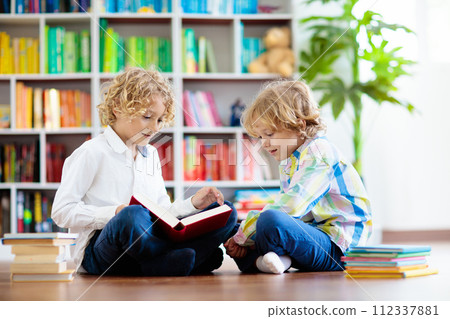 Child reading book. Kids read. School education. Child reading book. Kids read. School education. 112337881