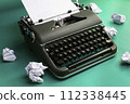 Vintage typewriter and crumpled paper sheets. Writer and blogger concept 112338445
