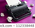 Vintage typewriter and crumpled paper sheets. Writer and blogger concept 112338448