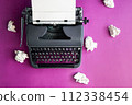 Vintage typewriter and crumpled paper sheets. Writer and blogger concept. Top view, flat lay 112338454