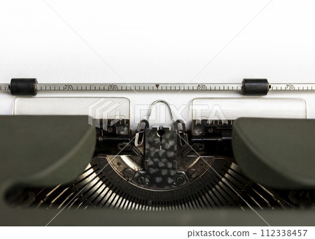 Vintage typewriter closeup. Blank paper sheet for copy space or add text 112338457