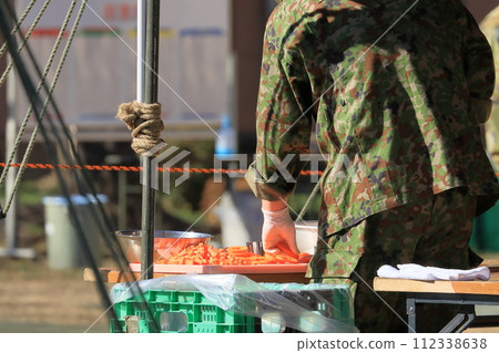 Self-Defense Forces soup kitchen training: Providing hot meals 112338638