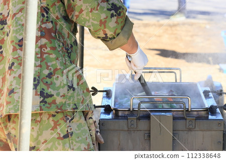 Self-Defense Forces soup kitchen training: Providing hot meals 112338648