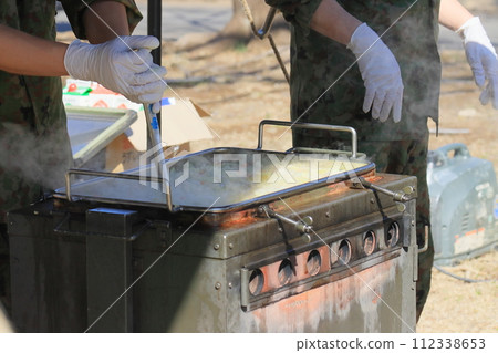 Self-Defense Forces soup kitchen training: Providing hot meals 112338653