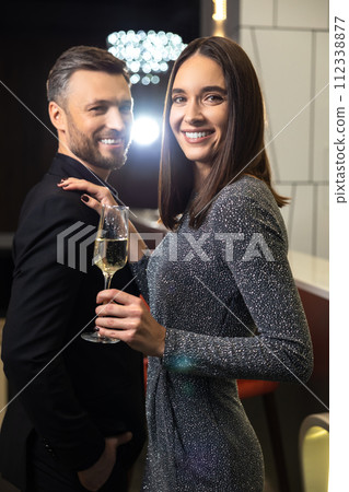 Young smiling couple looking flirty and excited Young smiling couple looking flirty and excited 112338877