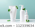 Cosmetic products on the table, white bottles and containers for skin care 112339634