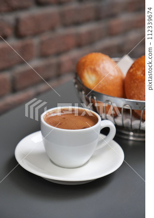a cup of turkish coffee on table  112339674