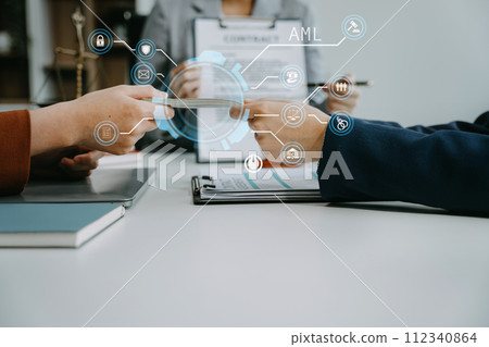 Businessman giving bribe money in the envelope to partner in a corruption scam in office. Businessman giving bribe money in the envelope to partner in a corruption scam in office. 112340864