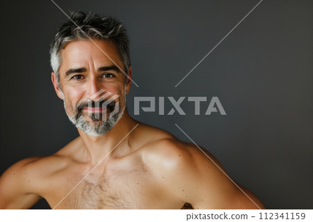 A man with a beard and a mustache is smiling 112341159