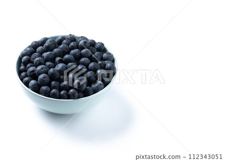 Blueberries in crystal bowl isolated on white background Blueberries in crystal bowl isolated on white background 112343051