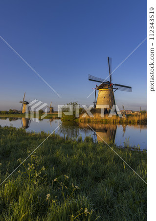 Traditional Dutch windmills in Kinderdijk - Unesco site, The Netherlands Traditional Dutch windmills in Kinderdijk - Unesco site, The Netherlands 112343519