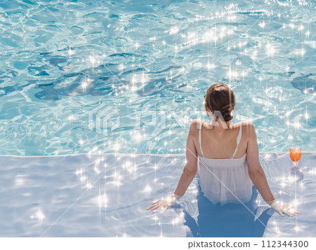 Cute woman with a glass of drink 112344300