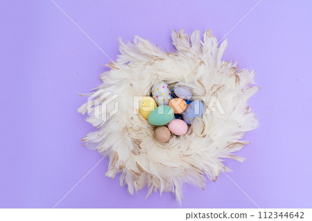 Easter colored eggs in nest 112344642