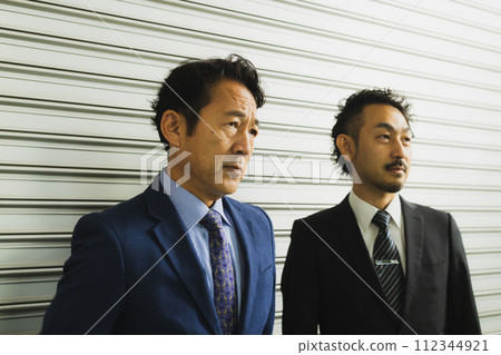 2 middle businessmen 112344921