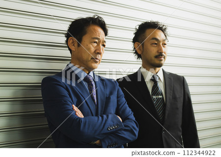 2 middle businessmen 2 middle businessmen 112344922