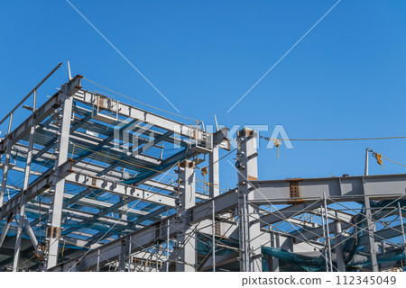 Blue sky and steel frame construction 112345049
