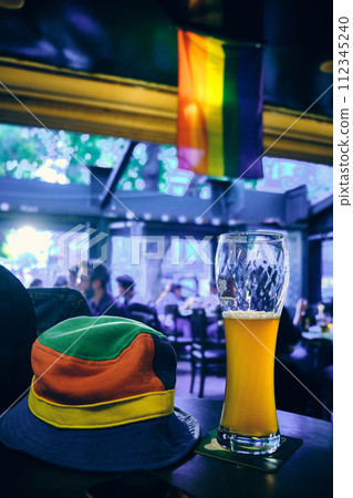 Colorful hat, beer glass and pride flag 112345240