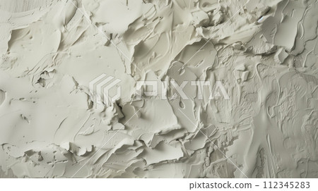 Closeup texture, fragment shot of the wall covered with white plaster, putty on the wall with artificially created irregularities to imitate antiquity Closeup texture, fragment shot of the wall covered with white plaster, putty on the wall with artificially created irregularities to imitate antiquity 112345283
