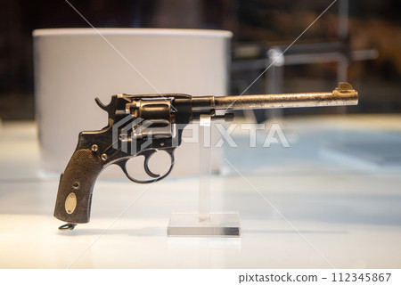 Long-barreled revolver. Pistol with a drum. Exhibit in the museum. 112345867