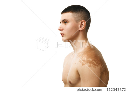 Handsome young man with short hair, spotless skin, muscular body with birthmark on shoulder isolated over white studio background Handsome young man with short hair, spotless skin, muscular body with birthmark on shoulder isolated over white studio background 112345872