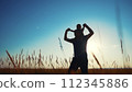father and son in the park. father's day silhouette happy family child dream concept. father carries his son on his back. dad walk with his son in nature in lifestyle the park silhouette at sunset 112345886