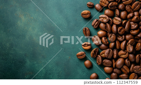 Freshly roasted coffee beans on green background, perfect for coffee shop or aroma ad Freshly roasted coffee beans on green background, perfect for coffee shop or aroma ad 112347559