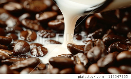 Roasted coffee beans with creamy milk being poured over them creating mesmerizing background. 112347565