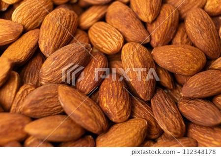 A lot of roasted nuts almond macro 112348178