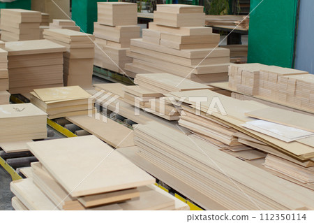 Woodworking industry. Many plywood stacked piles.Sliced plywood 112350114