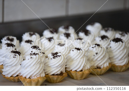 A lot of cake buns with protein cream 112350116