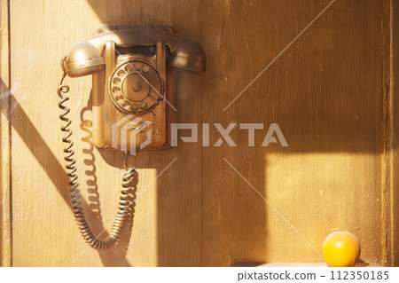 Retro phone in the booth. Telephone in the phone booth Retro phone in the booth. Telephone in the phone booth 112350185