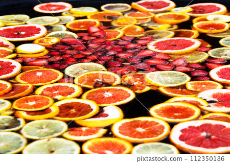Compote of fruits. Fruit water. Russian sbiten. Compote of orange and strawberries. 112350186