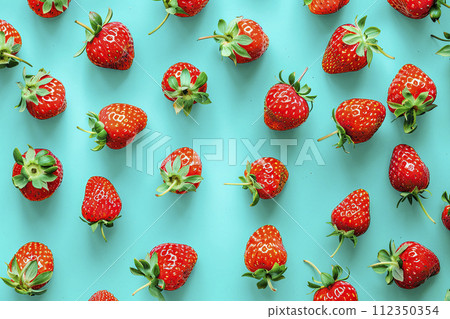 fruit pattern of fresh strawberries slices on green background. Top view. Ai generative 112350354