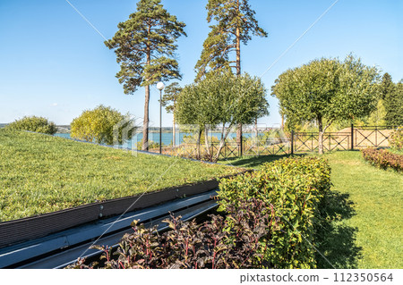 Guest house with metal rebated facade and lawn on flat roof 112350564