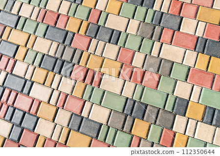 Colorful paving stones in urban park landscaping design as background 112350644