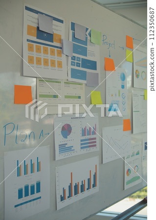 Laptop on a desk in an open financial office. Laptop on a desk in an open financial office. 112350687
