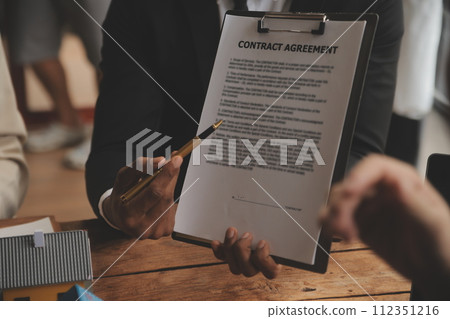 Real estate agent and Sales manager team analysis pricing of rental lease contract of sale purchase agreement, concerning mortgage loan offer for and house insurance. Real estate agent and Sales manager team analysis pricing of rental lease contract of sale purchase agreement, concerning mortgage loan offer for and house insurance. 112351216