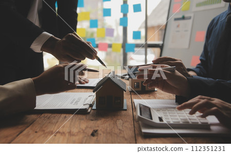 Real estate agent and Sales manager team analysis pricing of rental lease contract of sale purchase agreement, concerning mortgage loan offer for and house insurance. 112351231