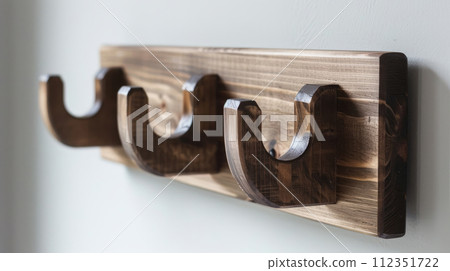 Handmade wooden wall hooks. A small creative project made from reclaimed wood. DIY 112351722